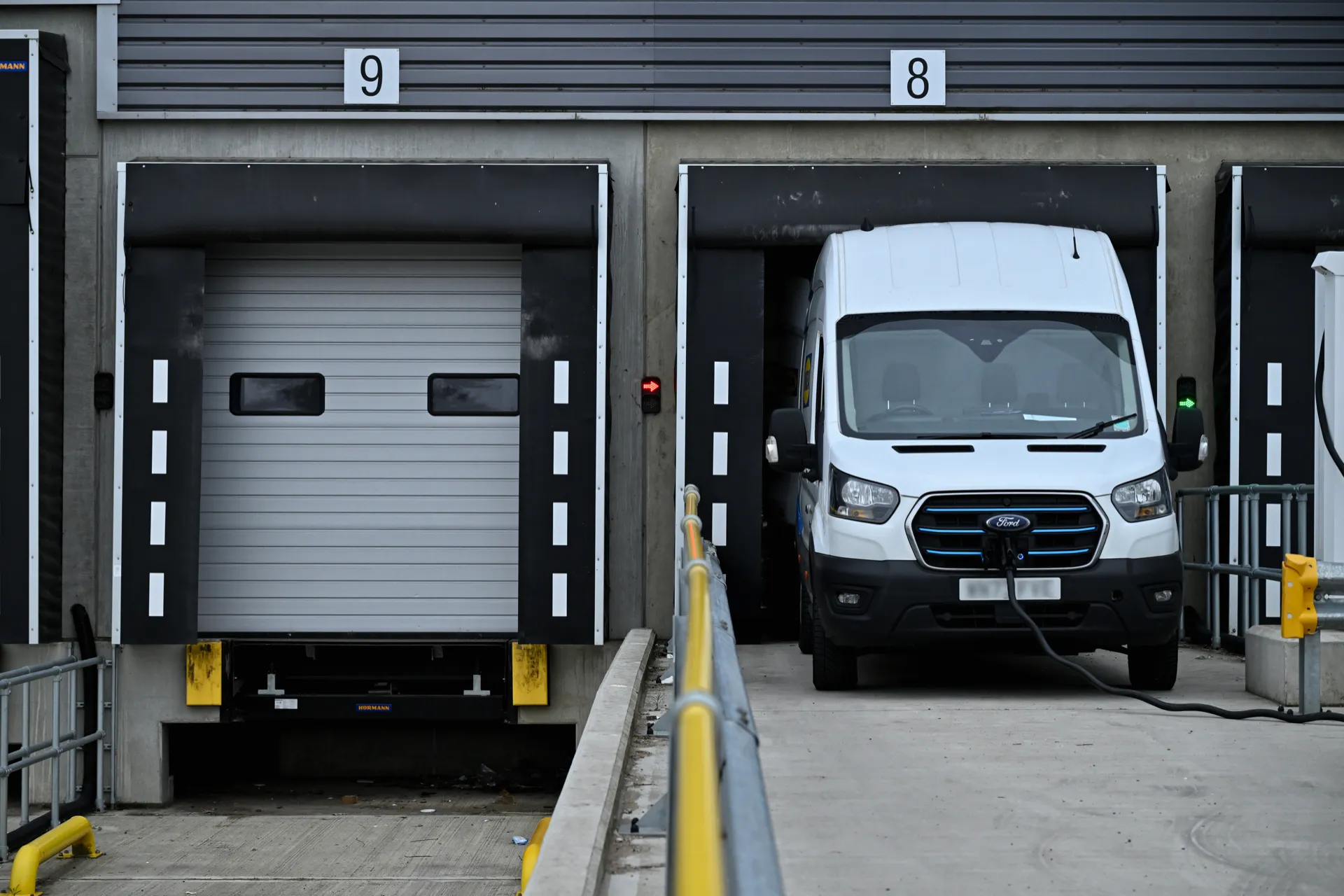 Electric van charging at dock